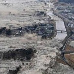 The tsunami washes across the Japanese coast